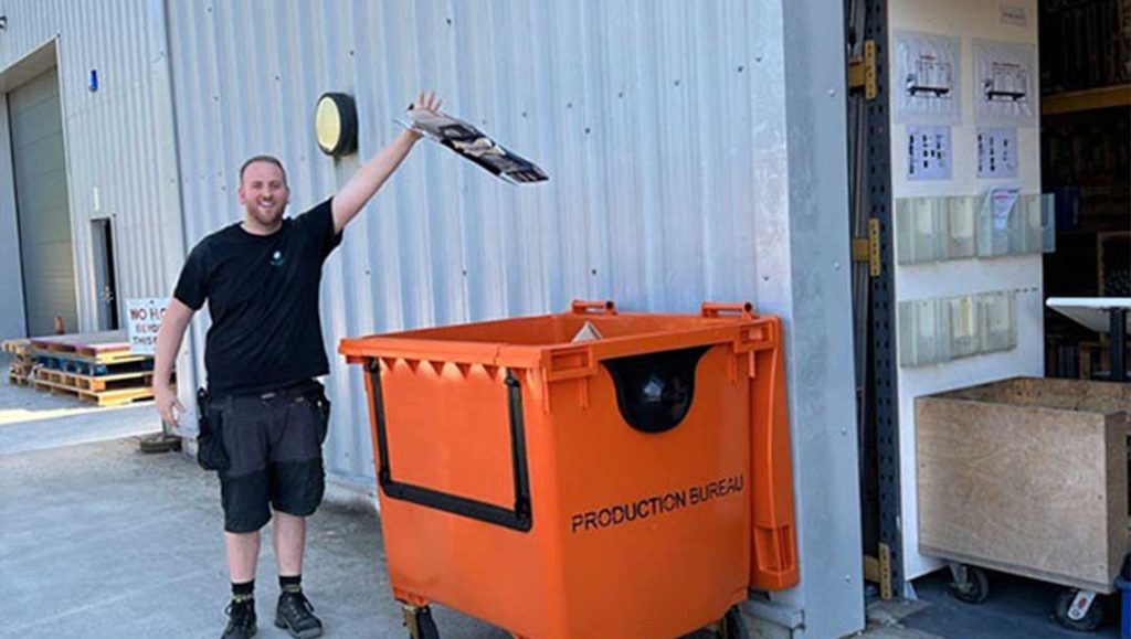 production bureau staff member recycling materials